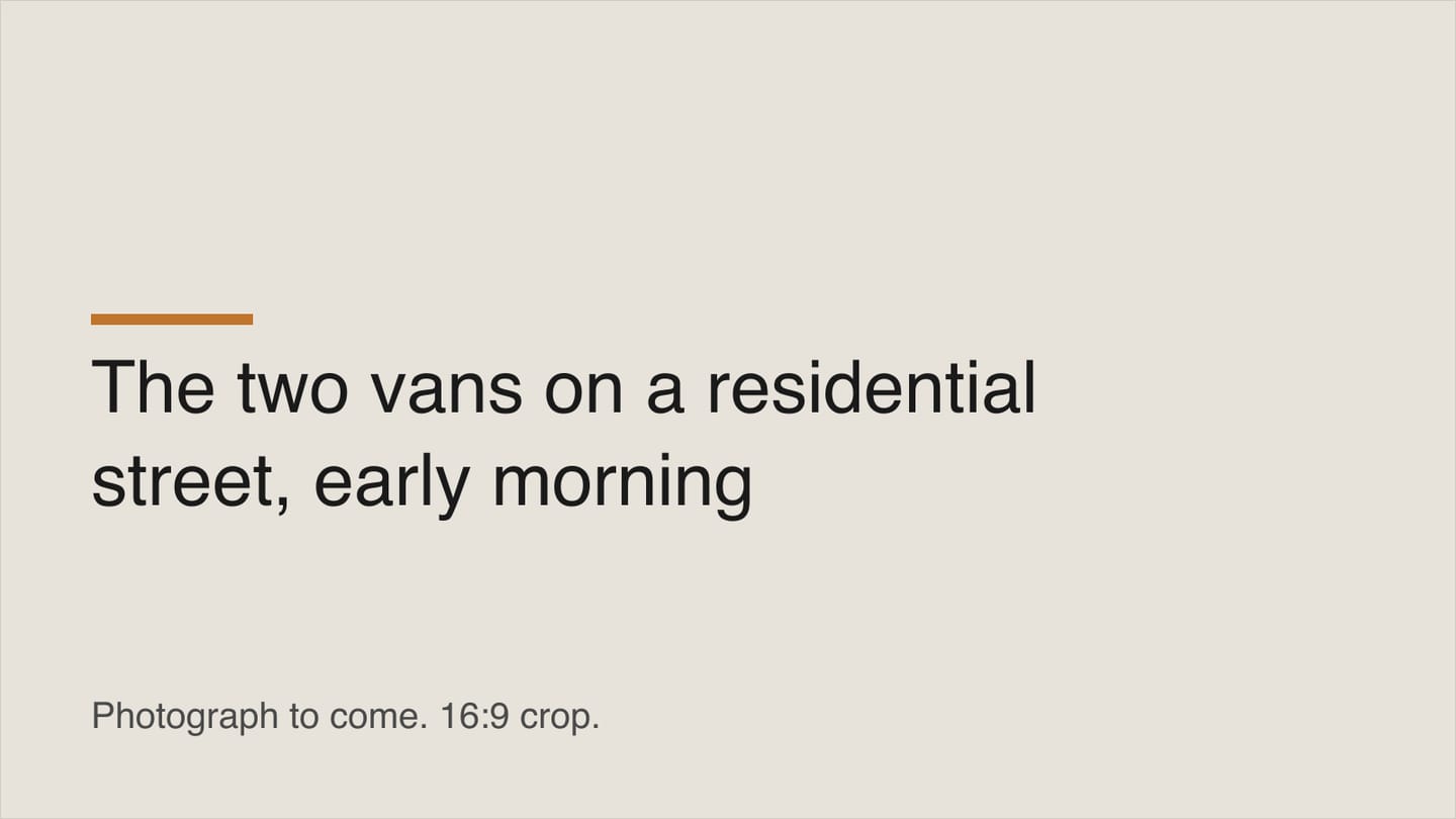 Two Kestrel Plumbing vans parked on a residential street in the early morning.